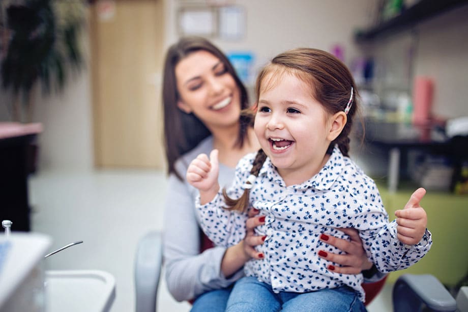 Child laughing with mother